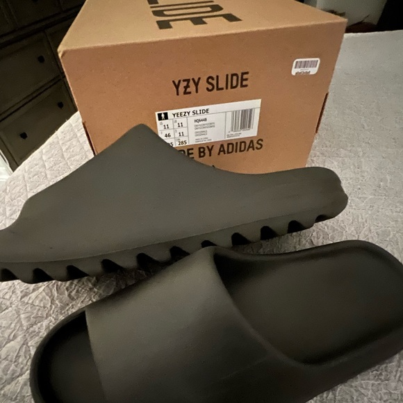 Selling YEEZY slides men’s size 11 in the onyx color by Adidas. - Picture 2 of 2